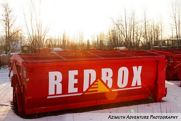 A red box train car with the word redbox on it.